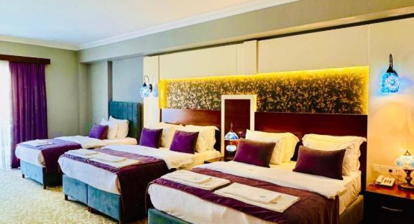 Deluxe Quadruple Room with Balcony